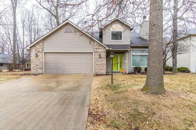 view of front of home featuring a garage and a front lawn