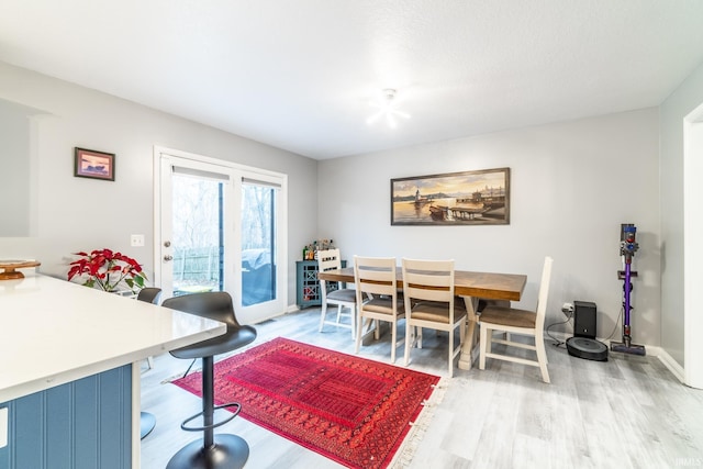 dining area with hardwood / wood-style floors