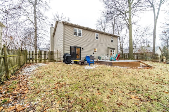 back of house with a wooden deck