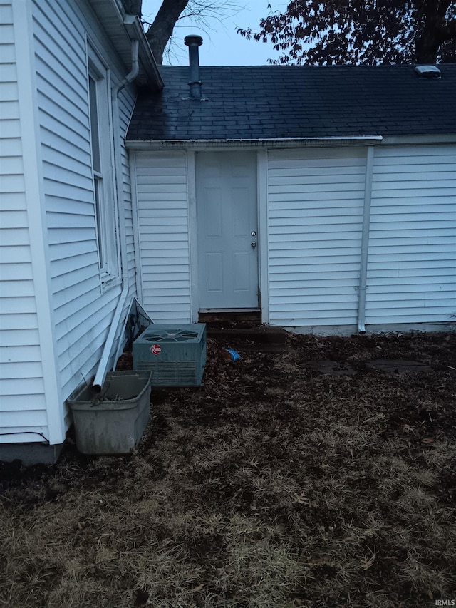 entrance to property featuring central AC