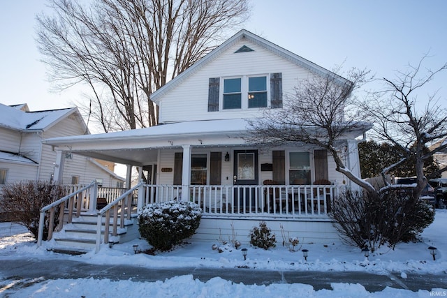 farmhouse-style home featuring covered porch