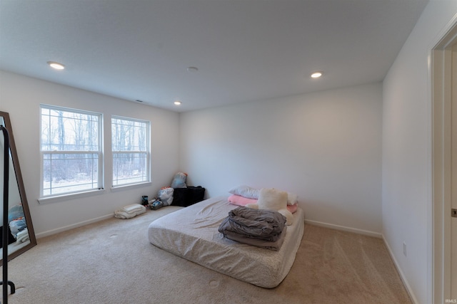 bedroom with light carpet