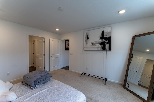 bedroom featuring light colored carpet