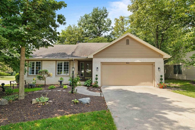 single story home featuring a garage