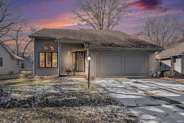 view of front of property with a garage