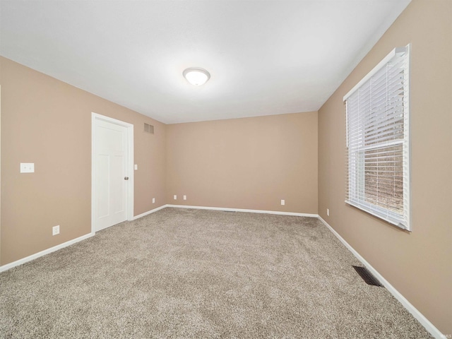 empty room featuring carpet flooring