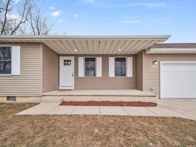 view of front of house featuring a garage and a porch