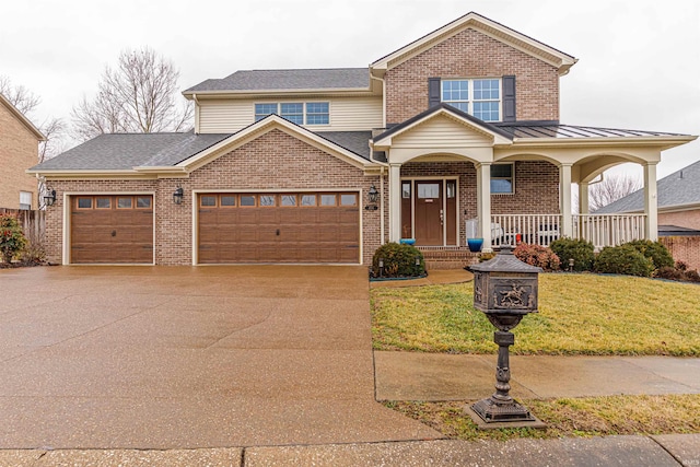 view of front of house featuring a garage, covered porch, and a front yard