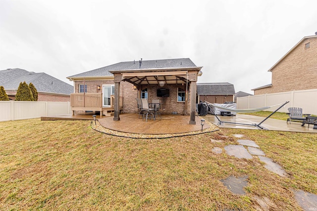 4595 Fieldcrest Place Cir, Newburgh, IN 47630 - rear view of house with brick siding, a fenced backyard, and a patio