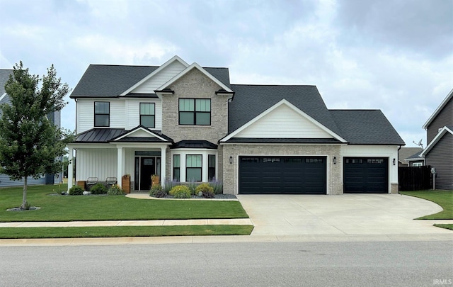 view of front of property with a garage and a front yard