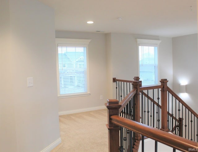 hallway with light carpet