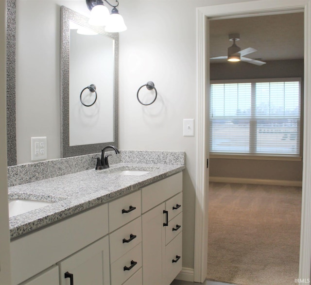 bathroom featuring vanity and ceiling fan