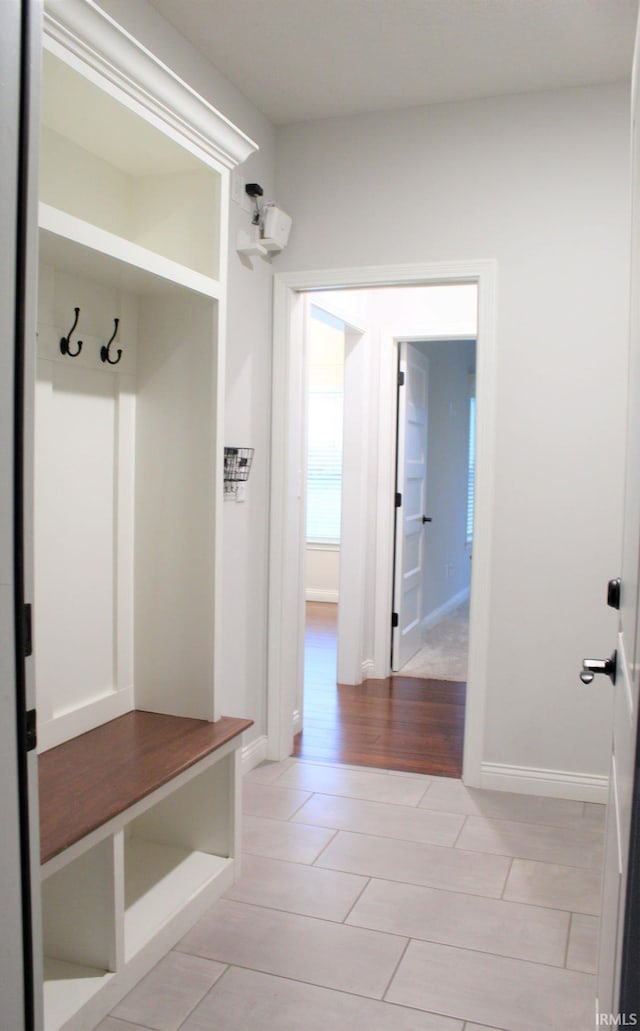 mudroom with light tile patterned flooring