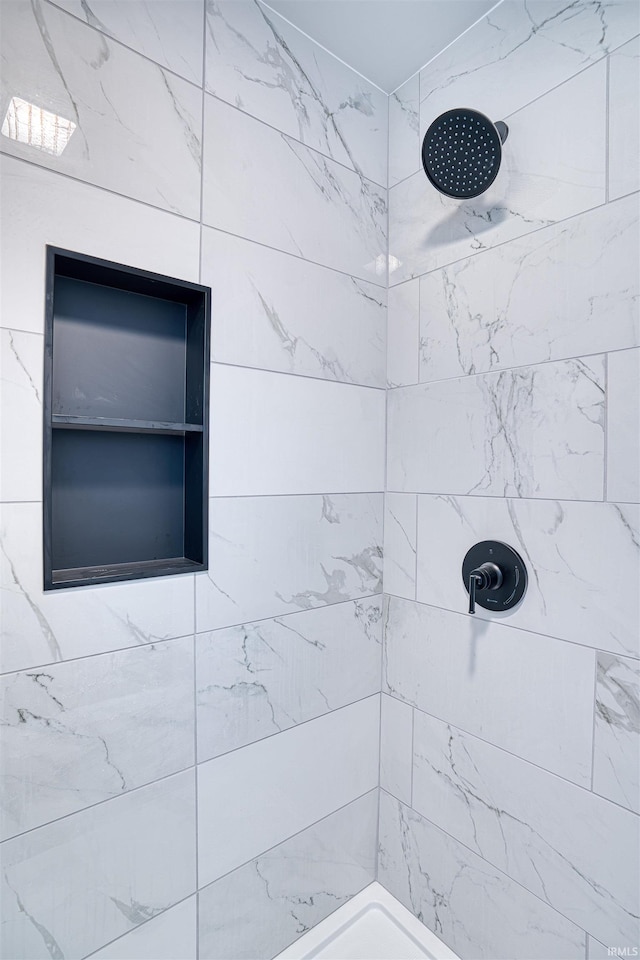 bathroom featuring tiled shower