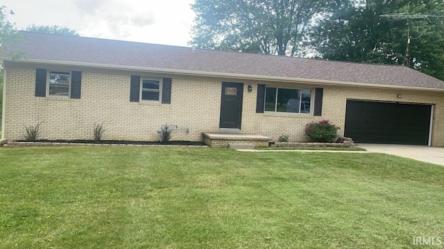 single story home featuring a garage, driveway, roof with shingles, a front lawn, and brick siding