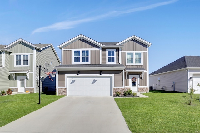 craftsman inspired home featuring a garage and a front lawn