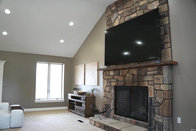 living room with light carpet, a fireplace, and high vaulted ceiling