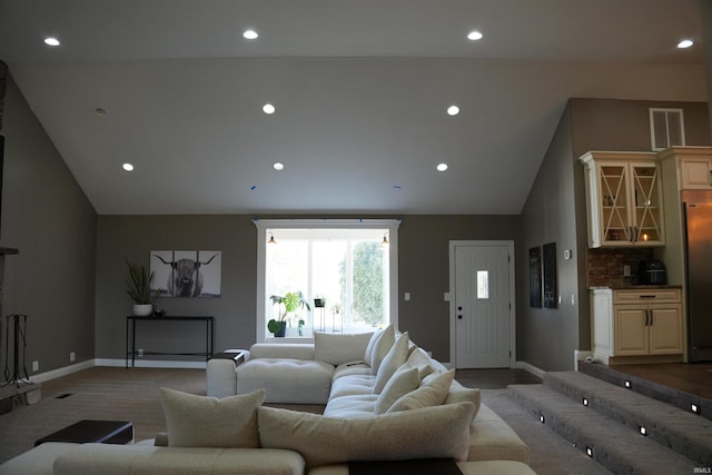 living room featuring lofted ceiling