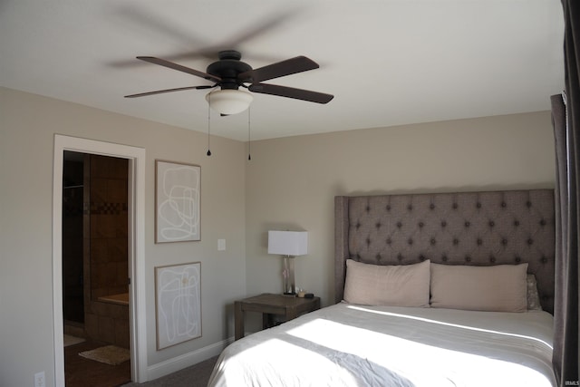 carpeted bedroom with ceiling fan and ensuite bathroom