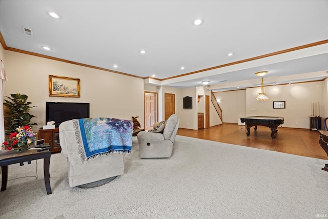 living room featuring crown molding, wood-type flooring, and pool table