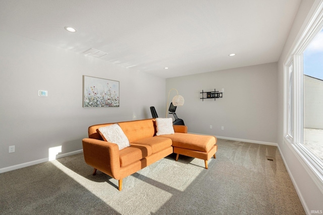 living room featuring a wealth of natural light, carpet flooring, baseboards, and recessed lighting