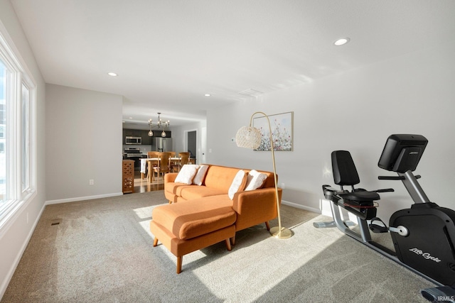 living room featuring a notable chandelier, recessed lighting, visible vents, baseboards, and carpet