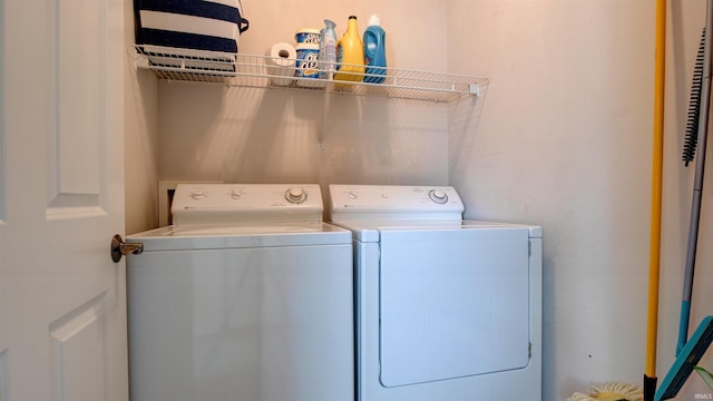 washroom with separate washer and dryer