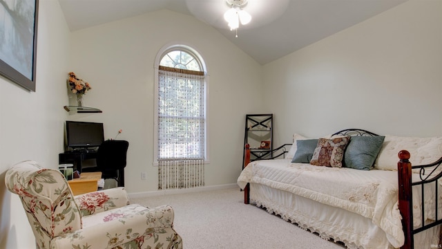 carpeted bedroom featuring lofted ceiling and ceiling fan