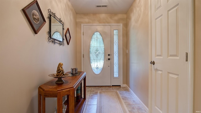 foyer featuring light tile patterned flooring