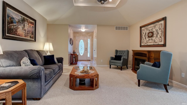 living room featuring light colored carpet and lofted ceiling