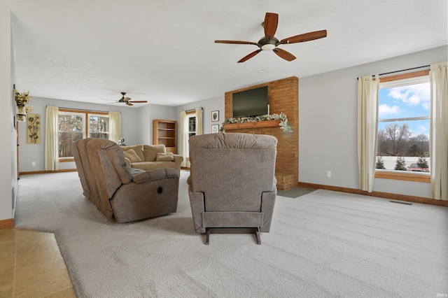 living room with light colored carpet and ceiling fan