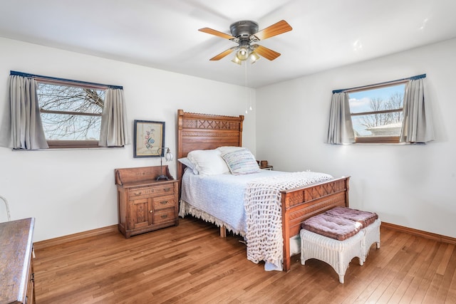 bedroom featuring hardwood / wood-style floors and ceiling fan