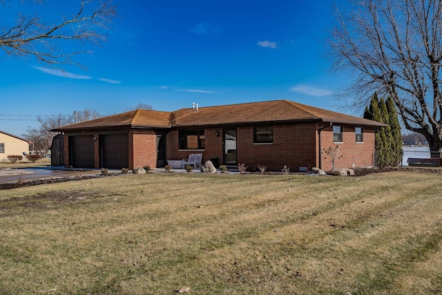 ranch-style house with a garage and a front yard