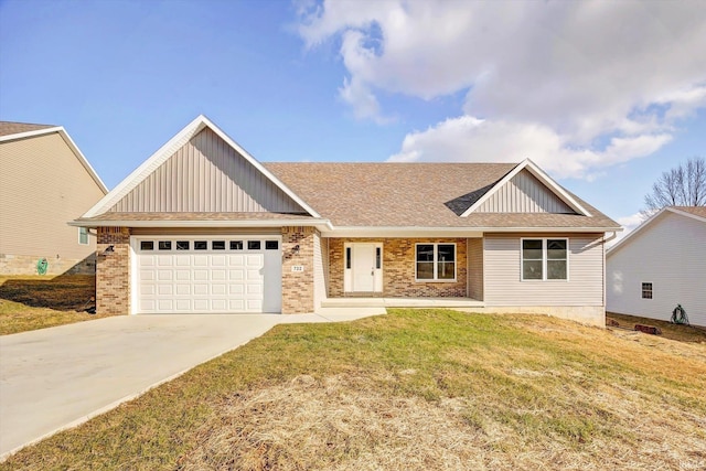 view of front facade with board and batten siding, a shingled roof, a front lawn, a garage, and driveway