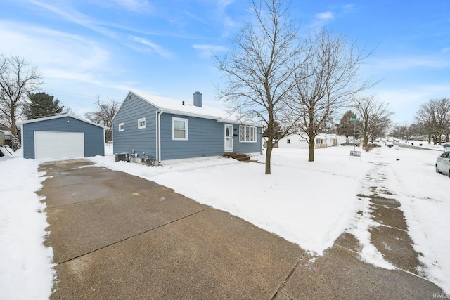 exterior space featuring an outbuilding and a garage