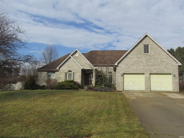 view of front of home with a garage and a front lawn