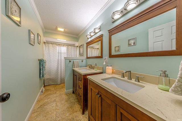 bathroom featuring ornamental molding, curtained shower, vanity, and a textured ceiling