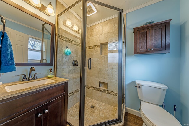 bathroom featuring crown molding, hardwood / wood-style floors, an enclosed shower, vanity, and toilet