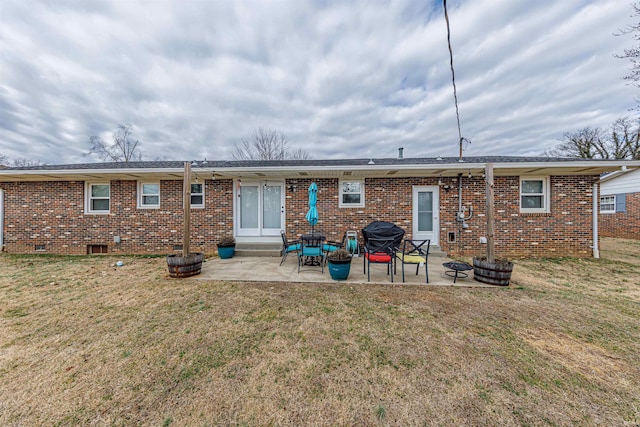 back of house with a yard and a patio area