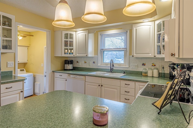 kitchen with white cabinetry, sink, backsplash, and dishwasher