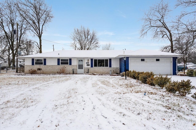 ranch-style house featuring a garage