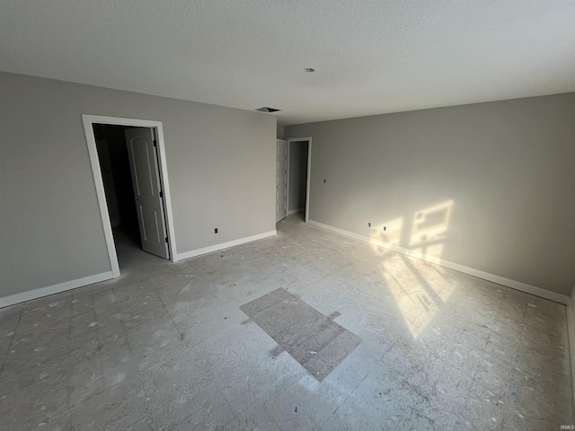 unfurnished bedroom with a textured ceiling