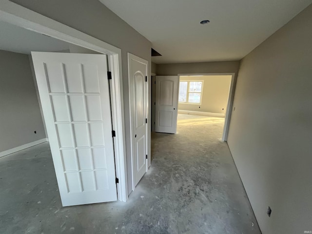 hall with concrete floors