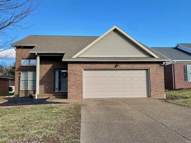 view of front of house with a garage and a front yard