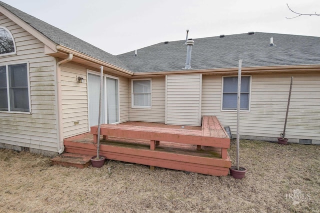 back of property with a yard and a deck