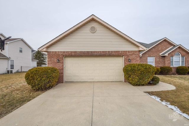 view of front facade featuring central AC unit, a garage, and a front lawn