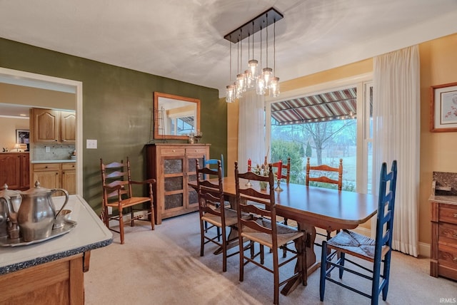 view of carpeted dining area