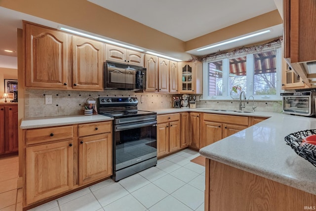 kitchen featuring light tile patterned floors, stainless steel electric range oven, sink, and backsplash