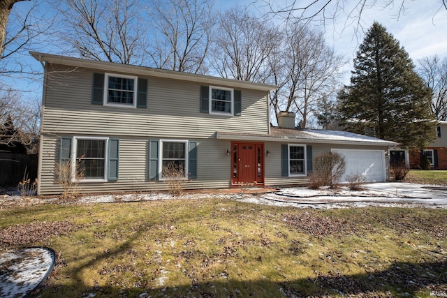 view of front facade with a garage and a front lawn