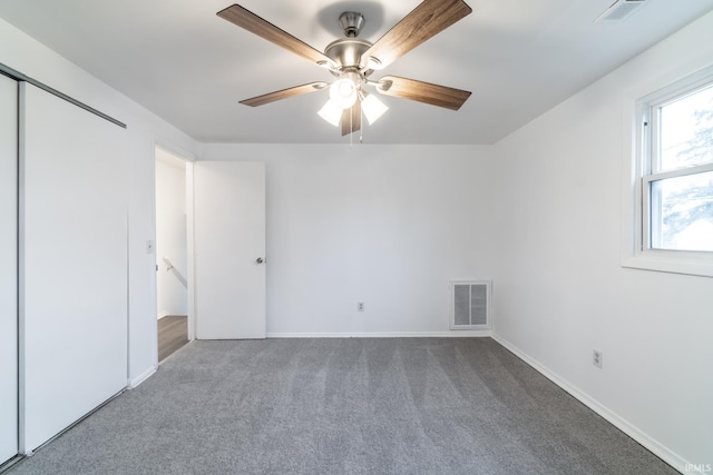 unfurnished bedroom with carpet floors and ceiling fan